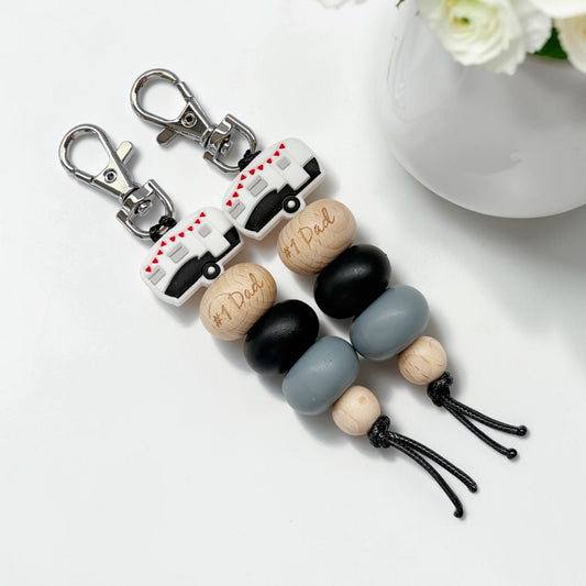 BLACK CARAVAN #1 DAD SILICONE BEAD KEYRING